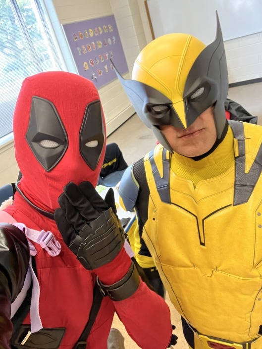 superhero duo at police event